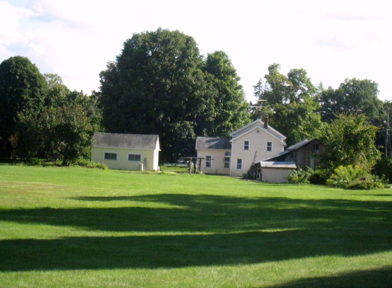 26 State Line Road West Stockbridge, MA 01266 - Photo 22 of 25 a front view of a house with a yard and trees