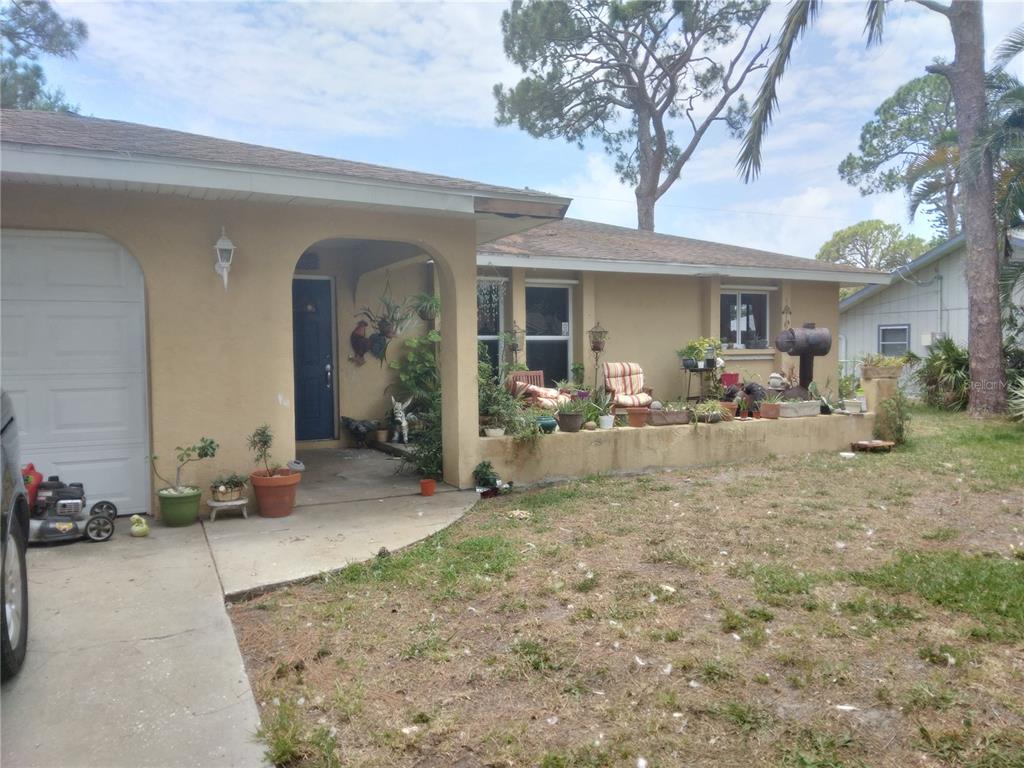 155 Cornell Road Venice, FL 34293 - Photo 1 of 1 a view of a house with backyard space and sitting area