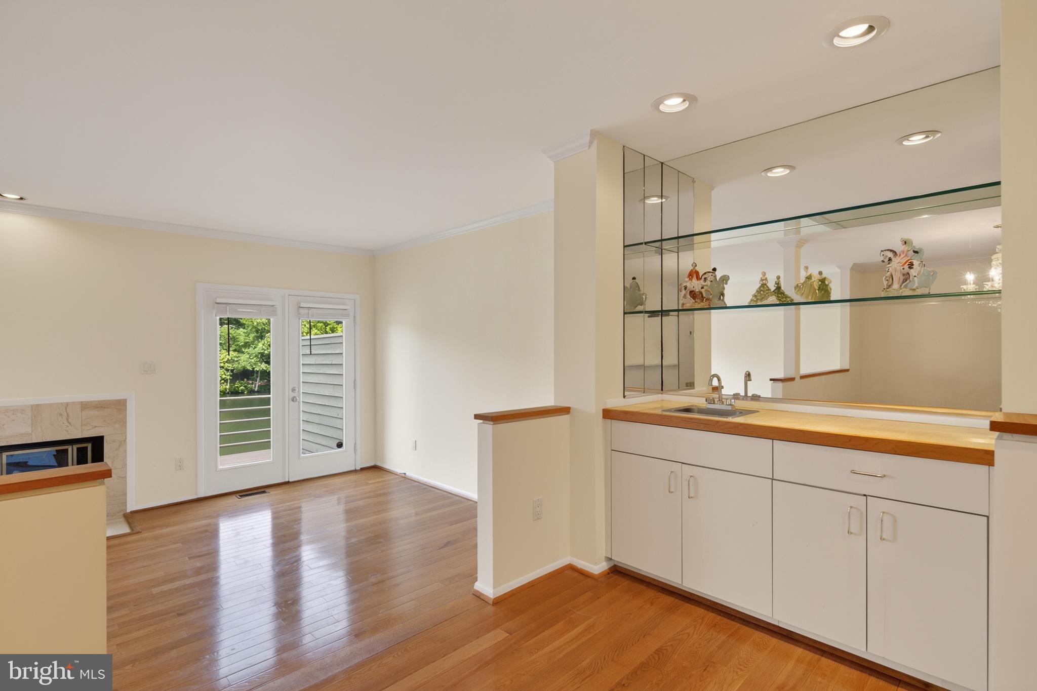 1987 Lakeport Way Reston, VA 20191 - Photo 14 of 56 Mirrored Wet Bar to Living Room French Doors
