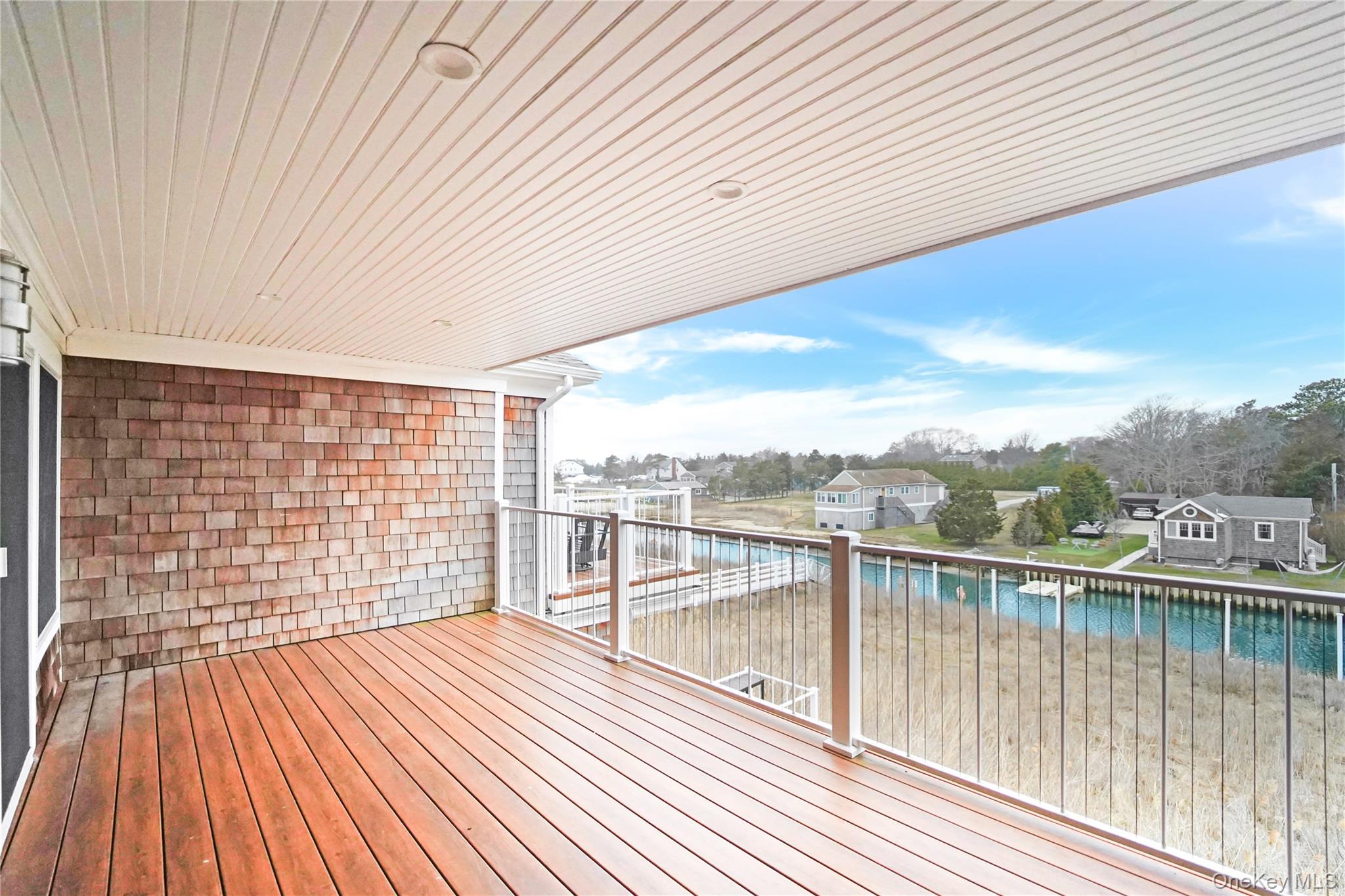 68 Foster Avenue, Unit 4 Hampton Bays, NY 11946 - Photo 13 of 17 a view of roof deck