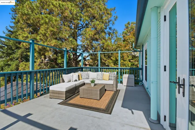 a view of a chairs and deck in the balcony