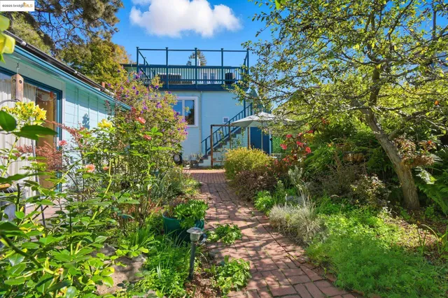 a backyard of a house with lots of green space