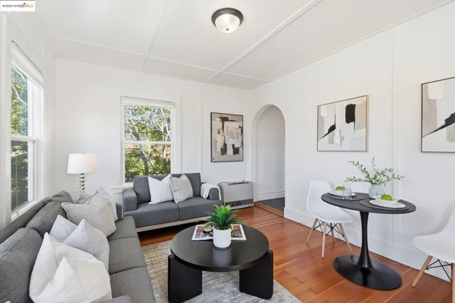 a living room with furniture and a table