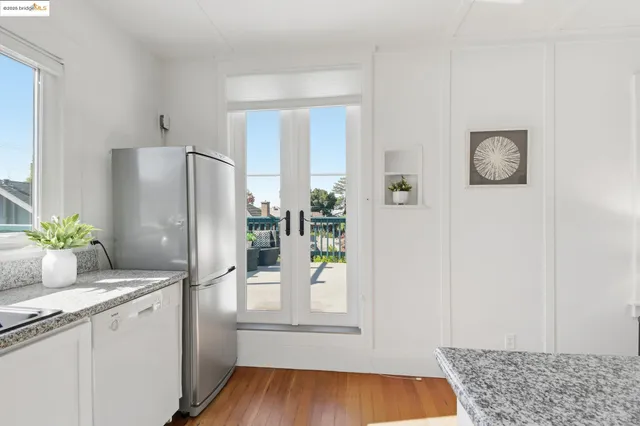 a room with a window and wooden floor