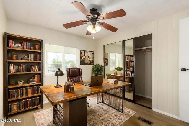 a view of a workspace with furniture