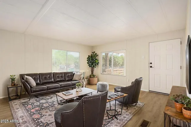 a living room with furniture and a window