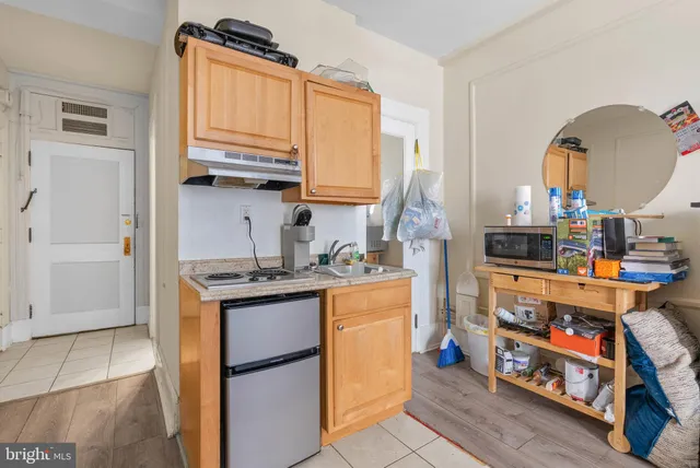 a kitchen with stainless steel appliances granite countertop a stove and a refrigerator
