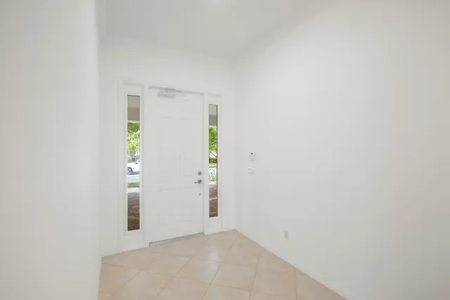 a kitchen with stainless steel appliances granite countertop a sink a stove a refrigerator and with wooden cabinets