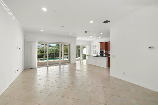 a kitchen with granite countertop a sink and cabinets