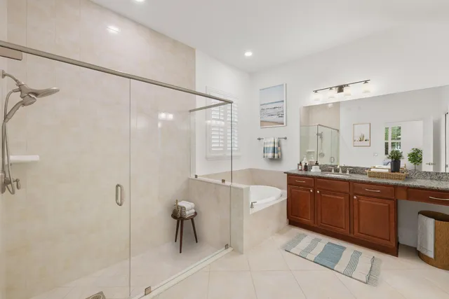 an aerial view of a house with outdoor space and garden