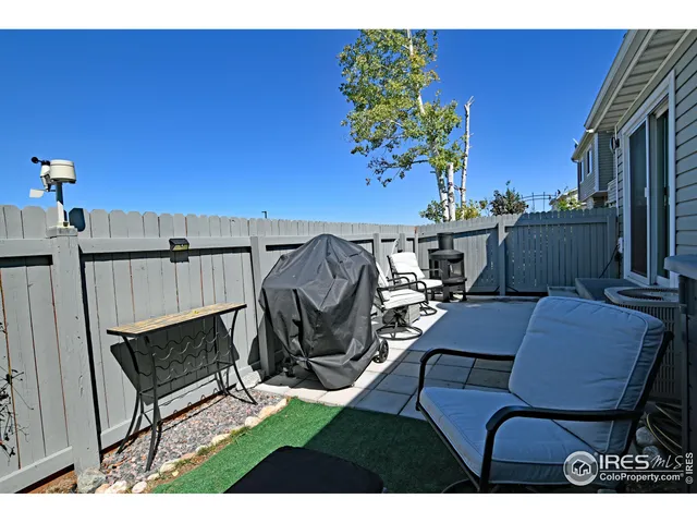 a view of a chairs and table in patio