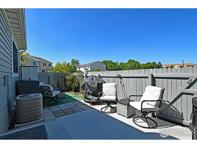 a view of a chairs and table in patio
