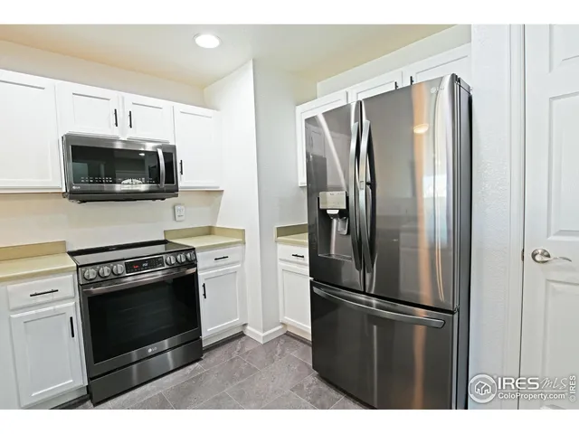 a kitchen with a stove microwave and a refrigerator