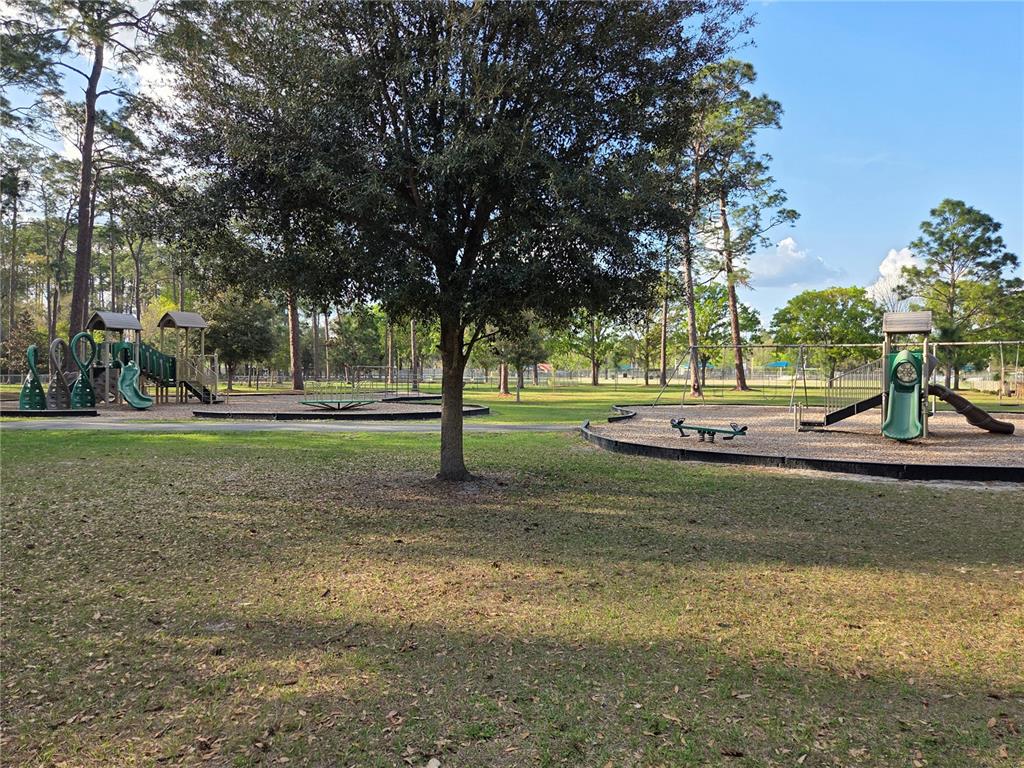 2 Northeast 13th Street Gainesville, FL 32601 - Photo 4 of 4 a view of a park with swings