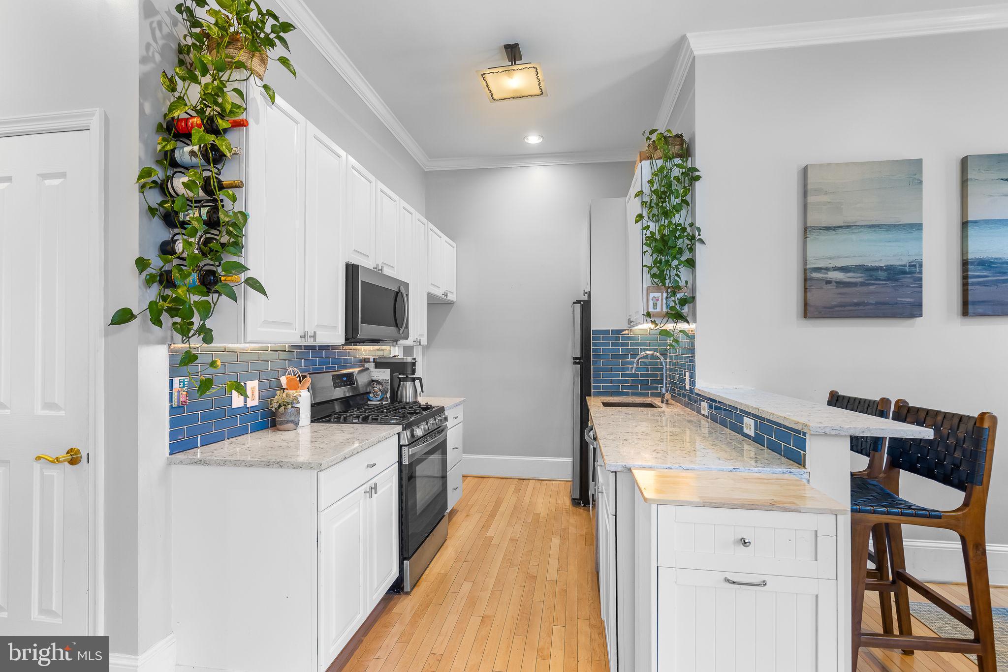 20 Logan Circle Northwest, Unit 12 Washington, DC 20005 - Photo 2 of 30 Stylish Kitchen with Ample Cabinetry