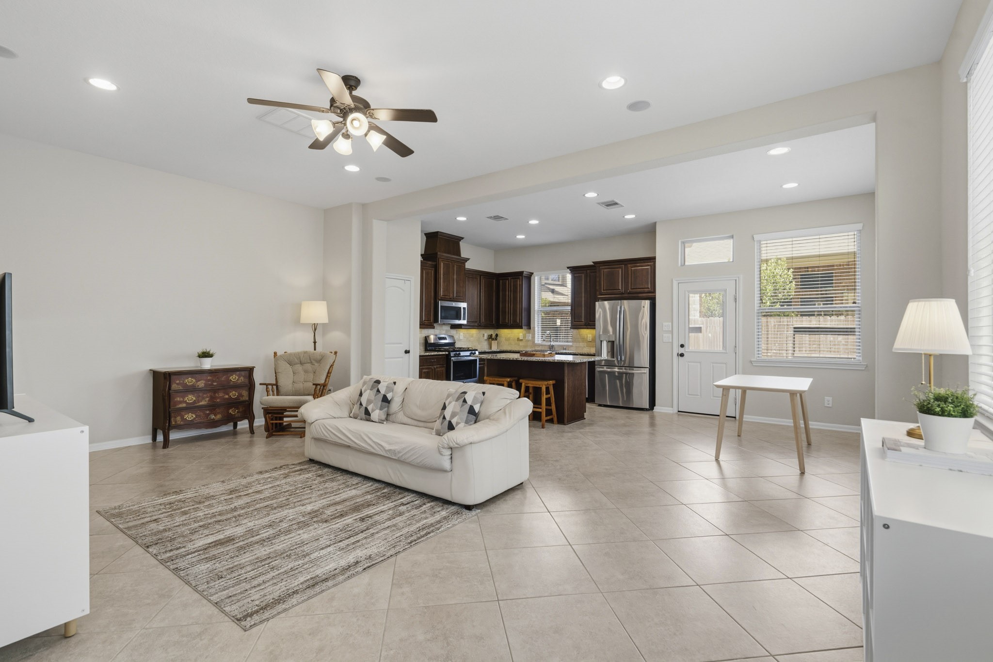 12115 San Luca Street Richmond, TX 77406 - Photo 43 of 44 Designed for today's lifestyle, the open-concept floor plan seamlessly connects the living room, kitchen, and dining spaces—perfect for entertaining or simply enjoying time with family.