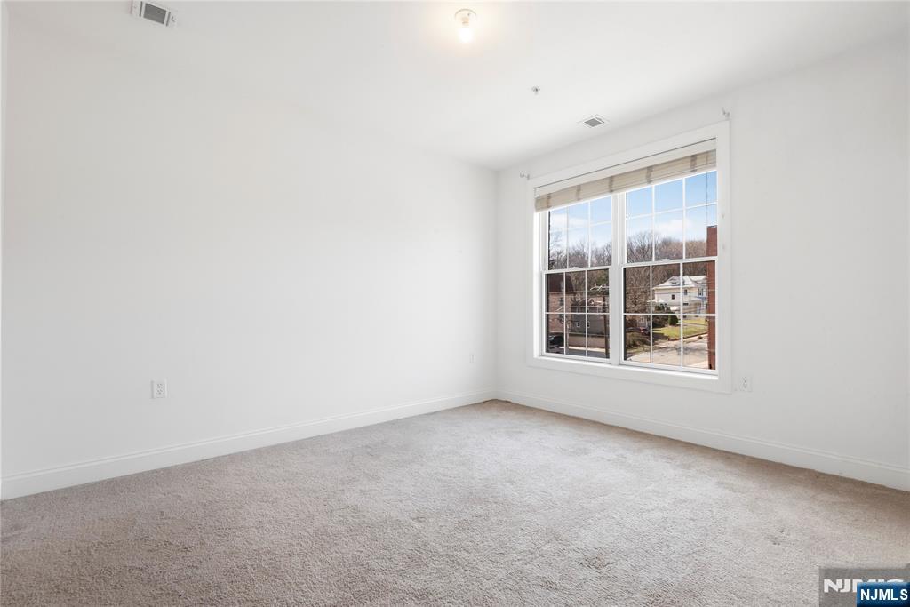 54 Polifly Road, Unit 311 Hackensack, NJ 07601 - Photo 12 of 20 a view of an empty room with a window