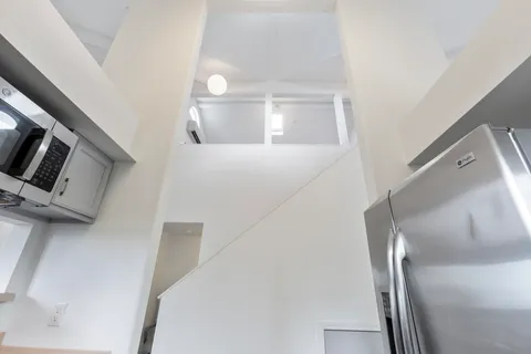 a view of a hallway with staircase