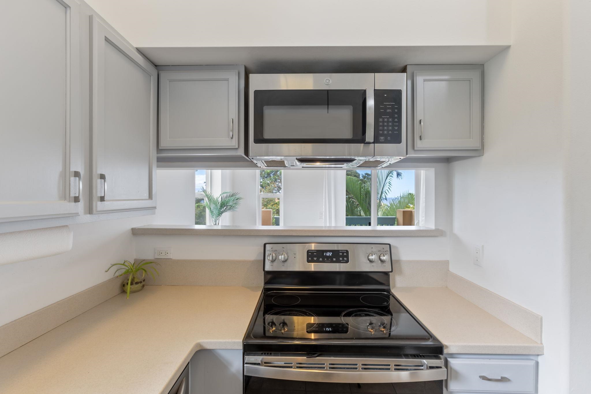 10 Heather Lane, Unit 231 Lahaina, HI 96761 - Photo 14 of 44 a kitchen with a stove and a microwave