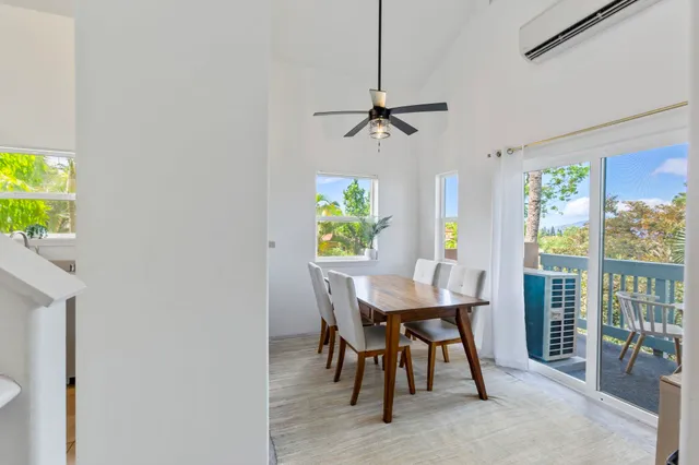 a view of a dining room with furniture and a window