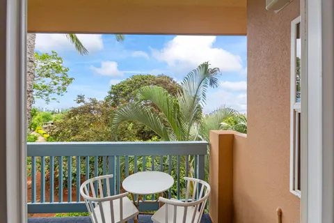 a view of a balcony with wooden floor