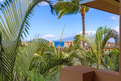 a view of a dining room with furniture and a window