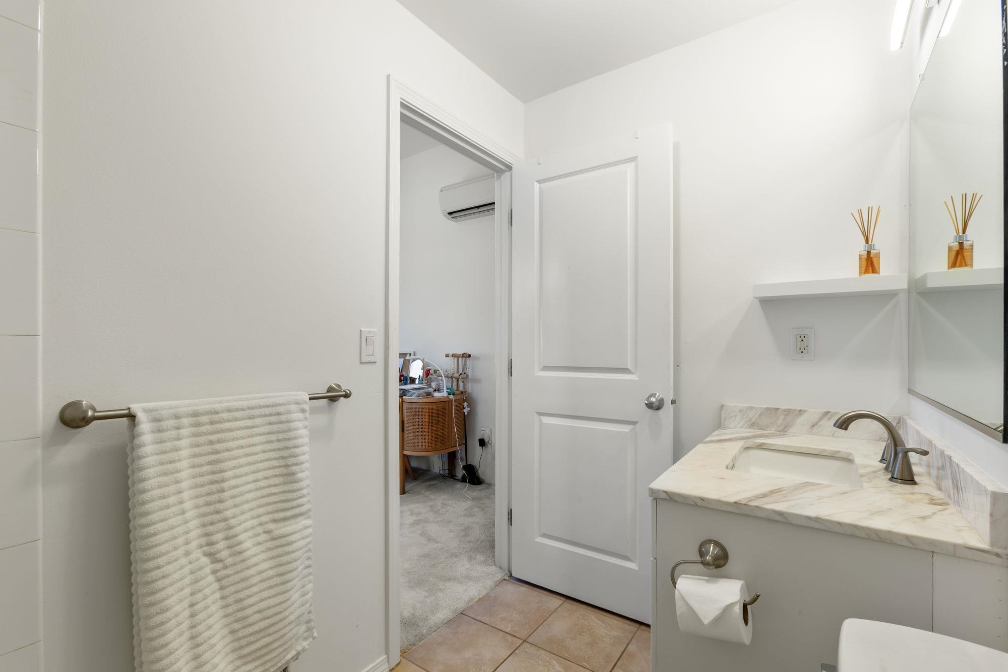 10 Heather Lane, Unit 231 Lahaina, HI 96761 - Photo 32 of 44 a bathroom with a sink and a mirror