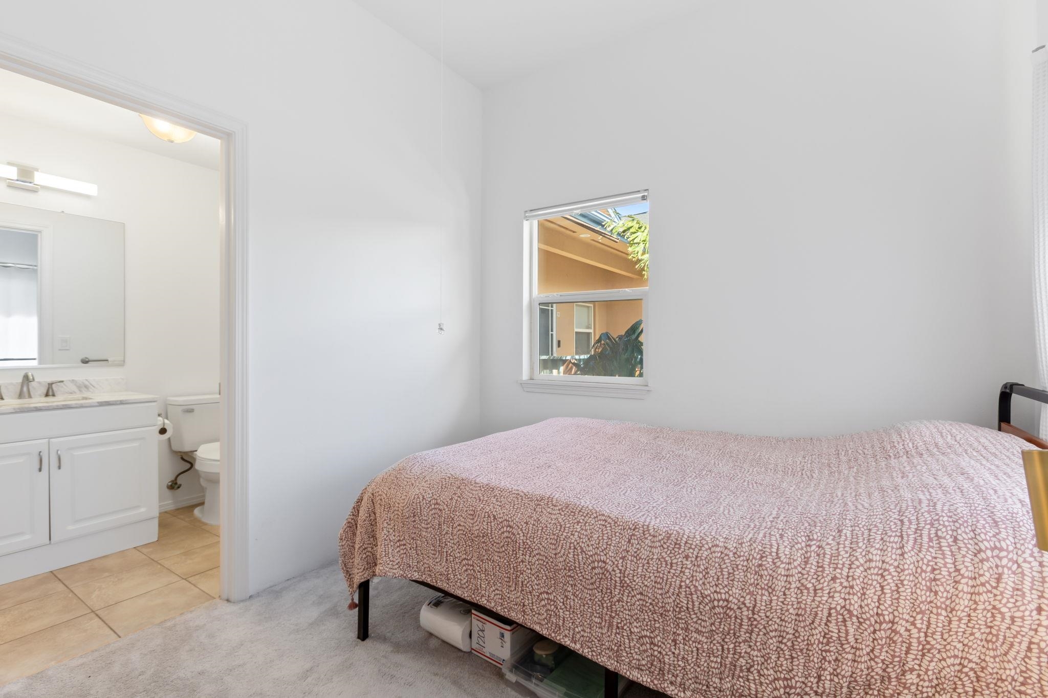 10 Heather Lane, Unit 231 Lahaina, HI 96761 - Photo 34 of 44 a bedroom with a bed and a window