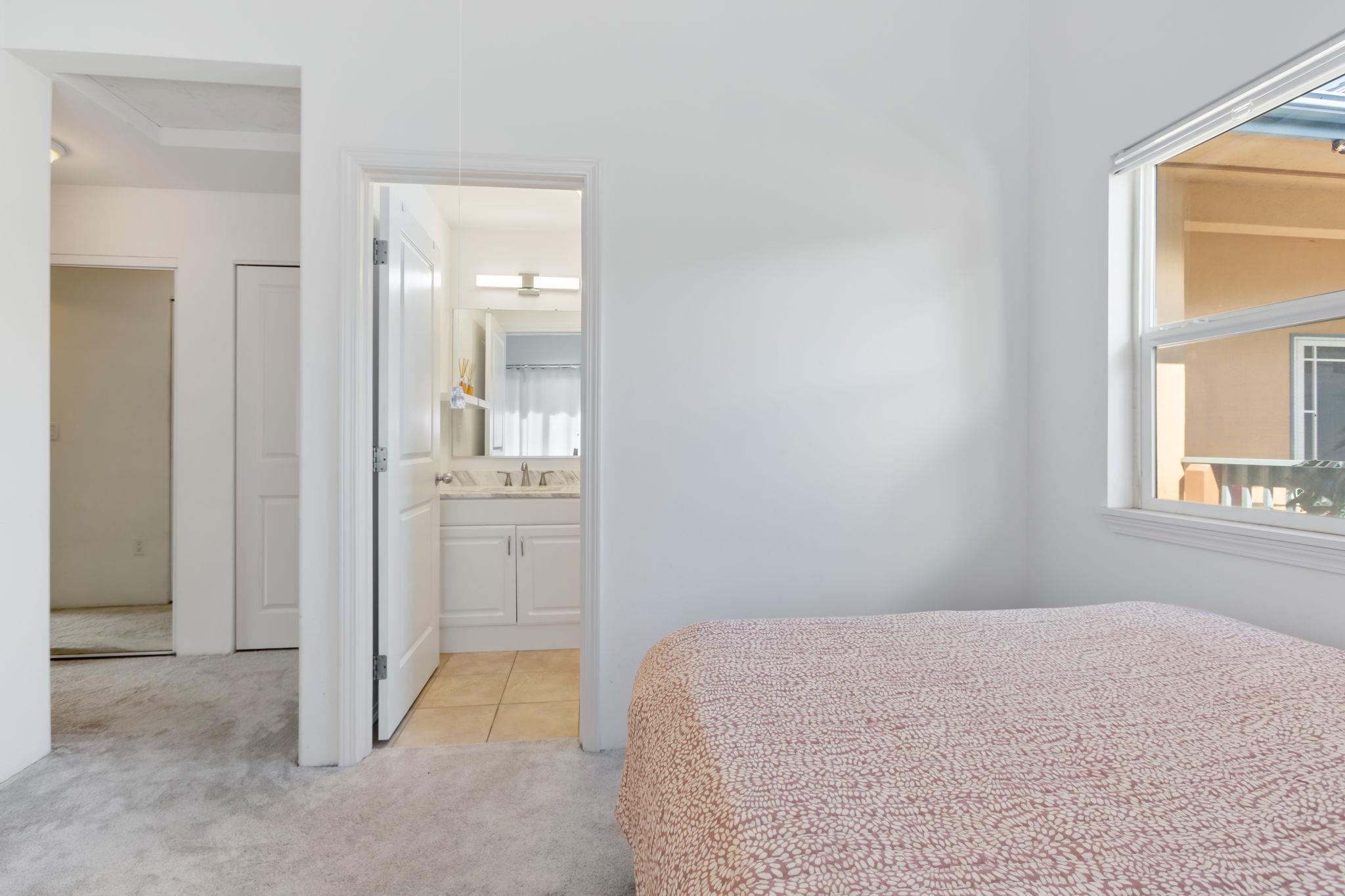 10 Heather Lane, Unit 231 Lahaina, HI 96761 - Photo 35 of 44 a bedroom with a bed and a window