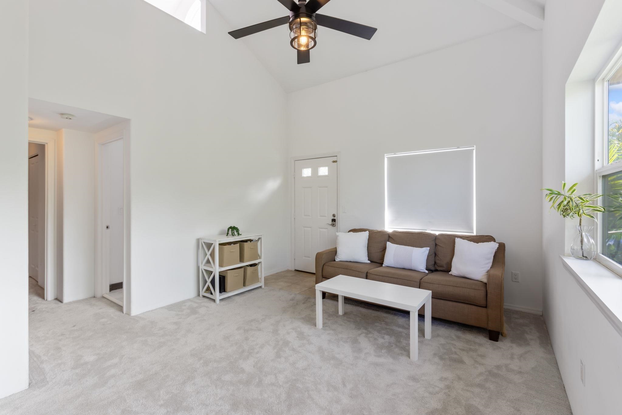 10 Heather Lane, Unit 231 Lahaina, HI 96761 - Photo 6 of 44 a living room with furniture and a ceiling fan
