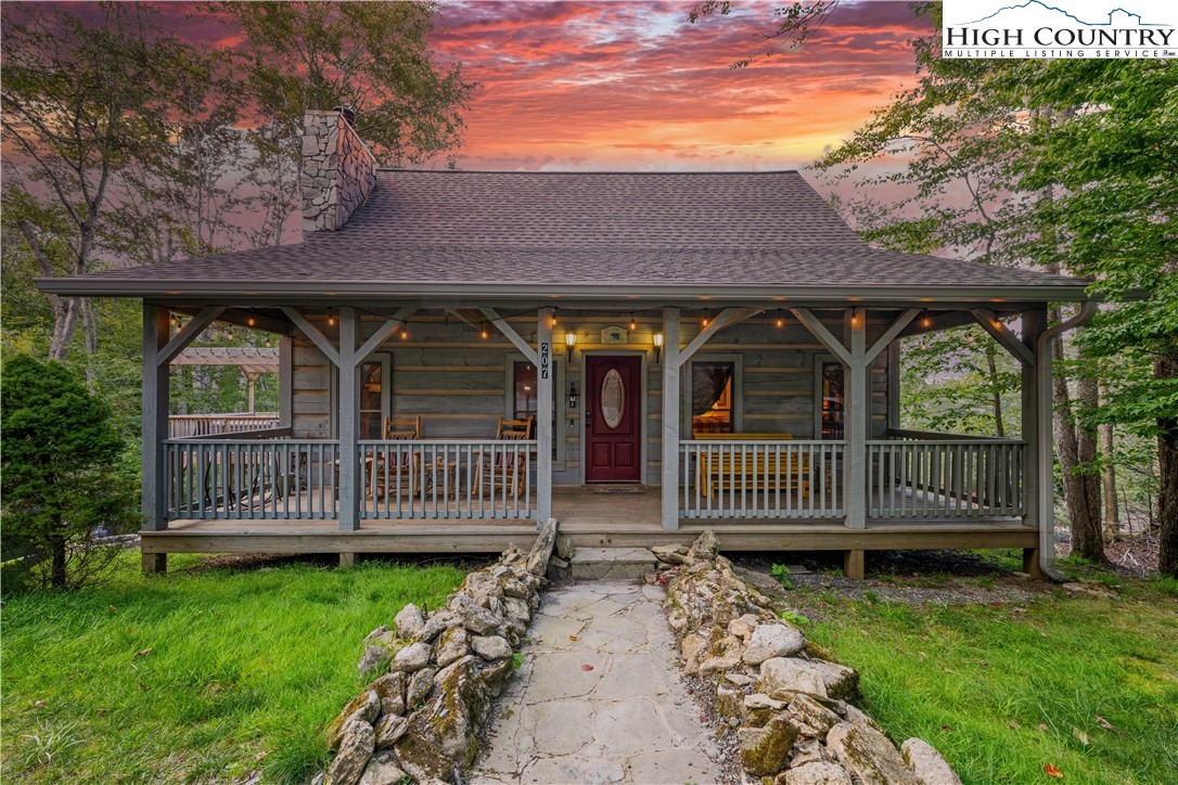 207 Lake Road Beech Mountain, NC 28604 - Photo 1 of 32 front view of house with a yard