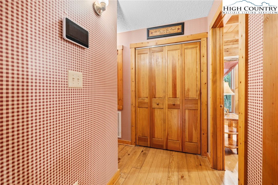 207 Lake Road Beech Mountain, NC 28604 - Photo 18 of 32 a view of a livingroom with wooden floor