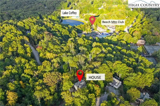 a sign that is sitting in front of flowers