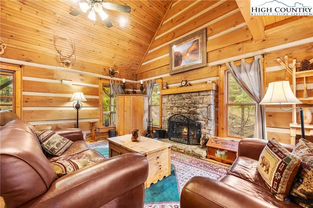 a outdoor living space with furniture and a fireplace