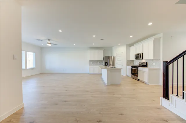 a view of kitchen with wooden floor