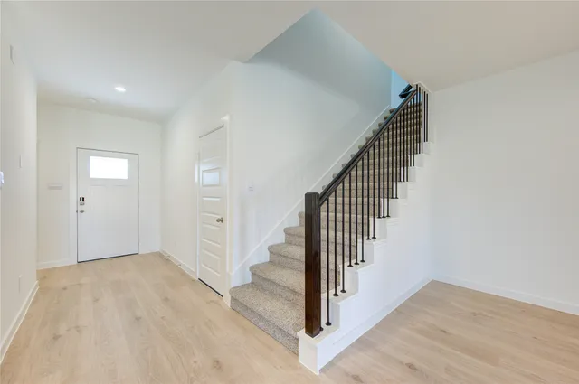 a view of entryway with wooden floor