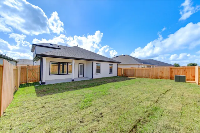 a view of a house with a back yard