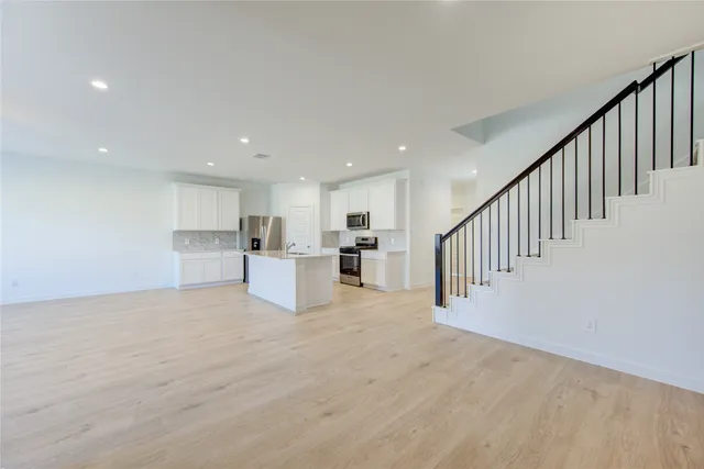 a view of kitchen with wooden floor