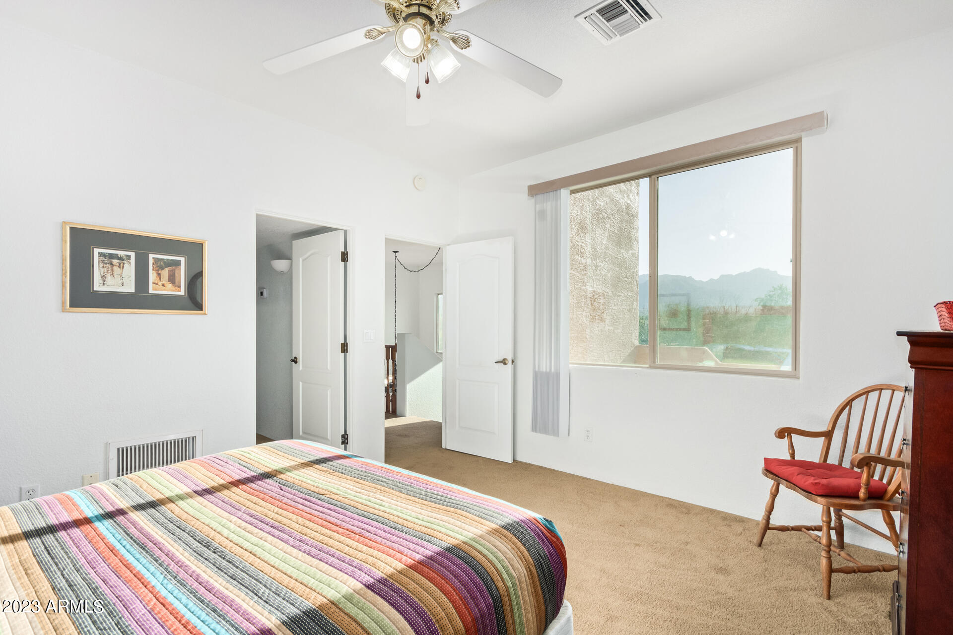 1940 South Val Vista Road Apache Junction, AZ 85119 - Photo 64 of 97 a bedroom with a bed and a chair