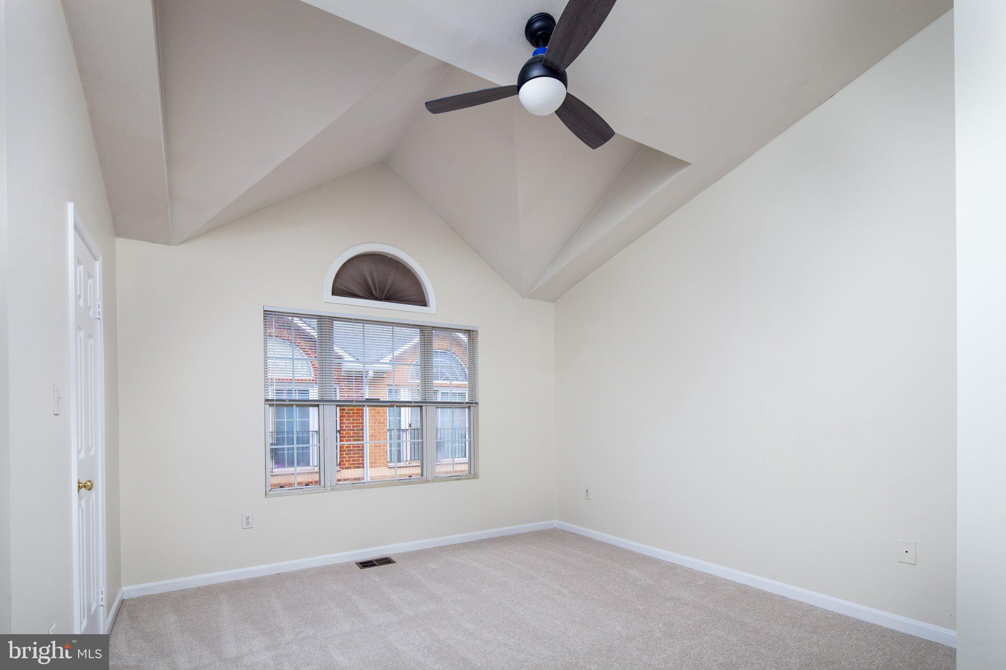 3040 South Glebe Road, Unit 3040 Arlington, VA 22206 - Photo 17 of 33 an empty room with windows and fan