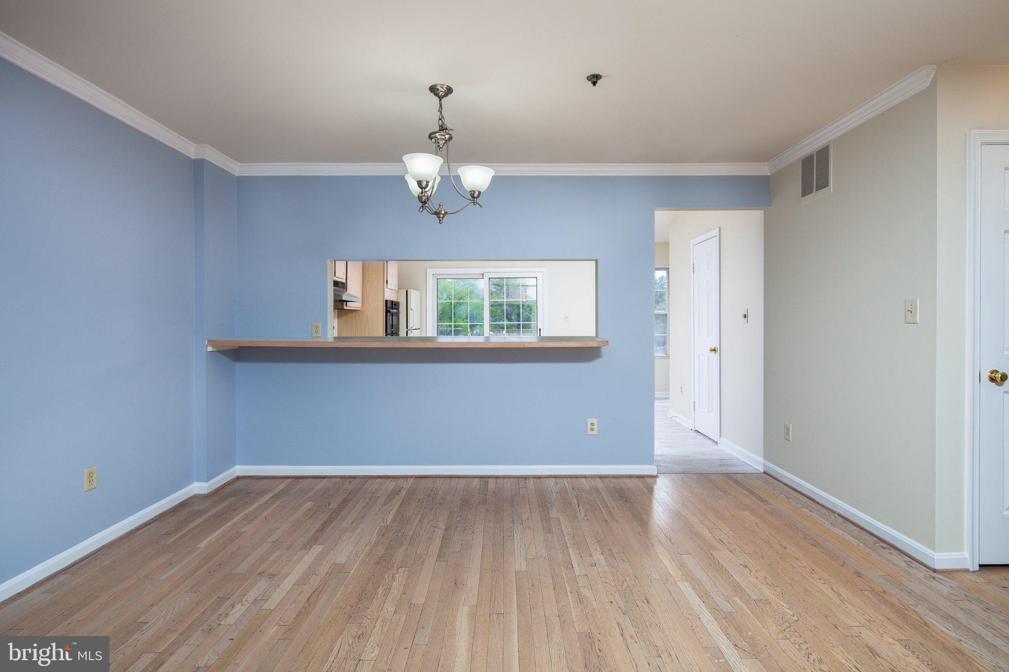 3040 South Glebe Road, Unit 3040 Arlington, VA 22206 - Photo 6 of 33 wooden floor in an empty room with a window
