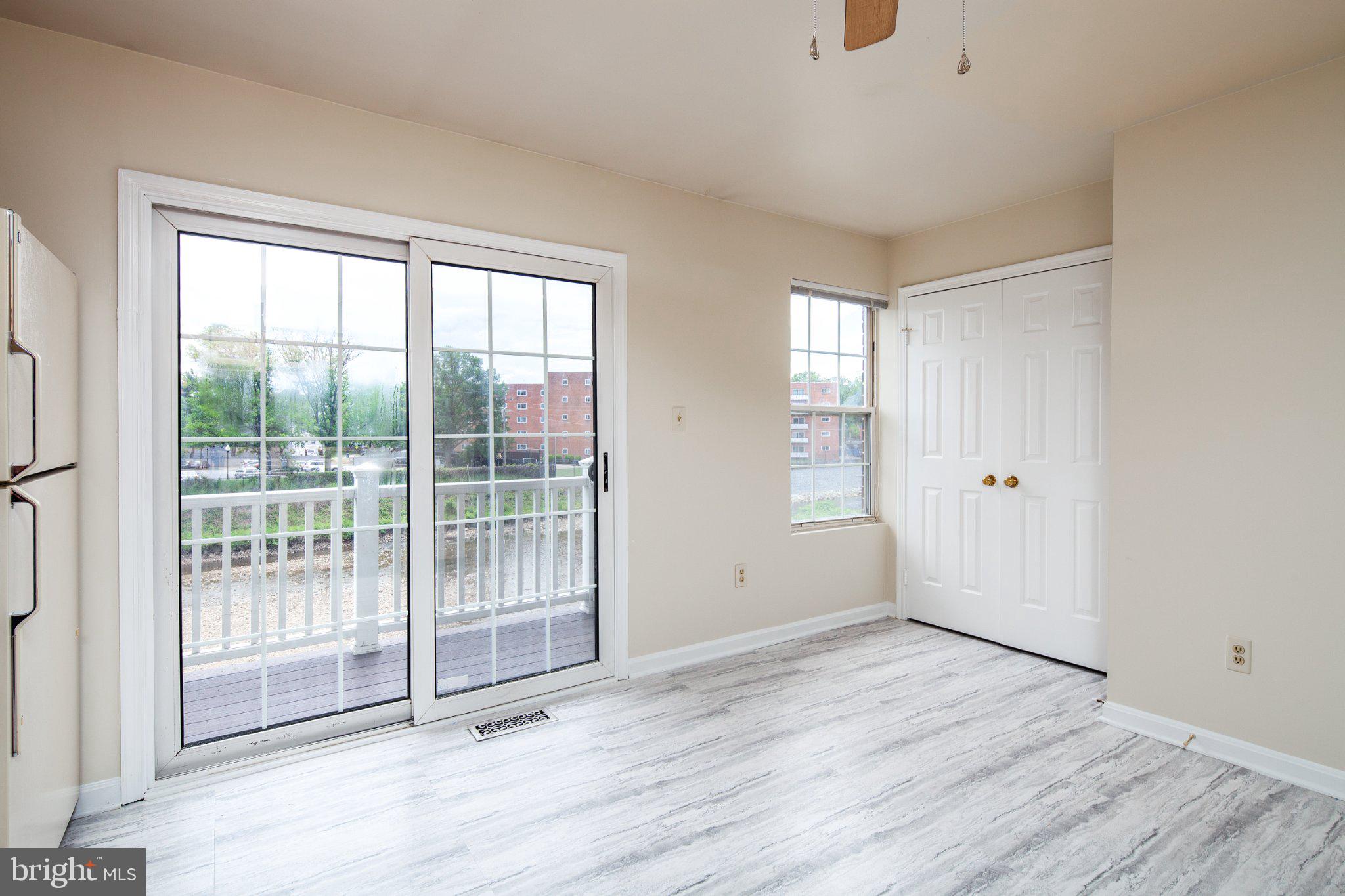 3040 South Glebe Road, Unit 3040 Arlington, VA 22206 - Photo 10 of 33 a view of empty room with wooden floor and fan
