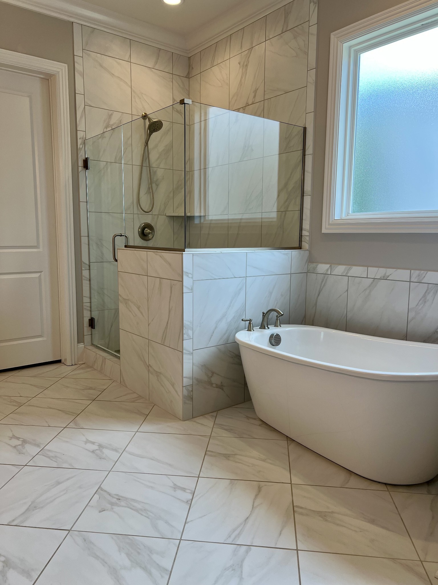 2001 Erwin Street Franklin, TN 37064 - Photo 17 of 30 a bathroom with a bathtub and shower