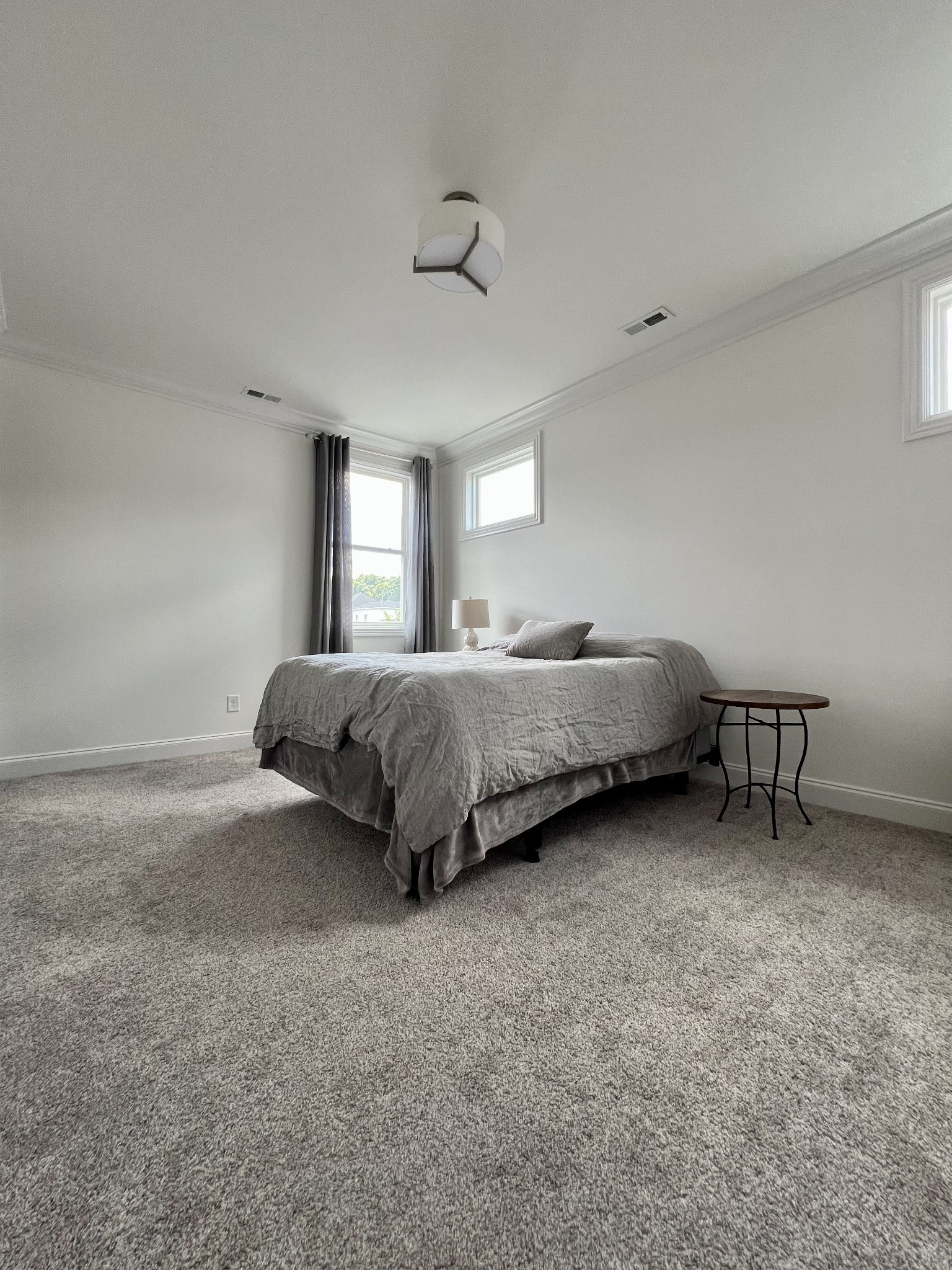 2001 Erwin Street Franklin, TN 37064 - Photo 26 of 30 a spacious bedroom with a bed and a chair
