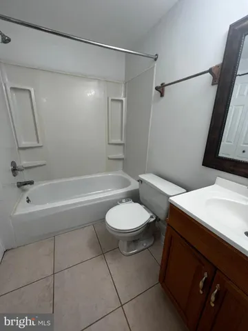a bathroom with a sink a toilet and a bathtub