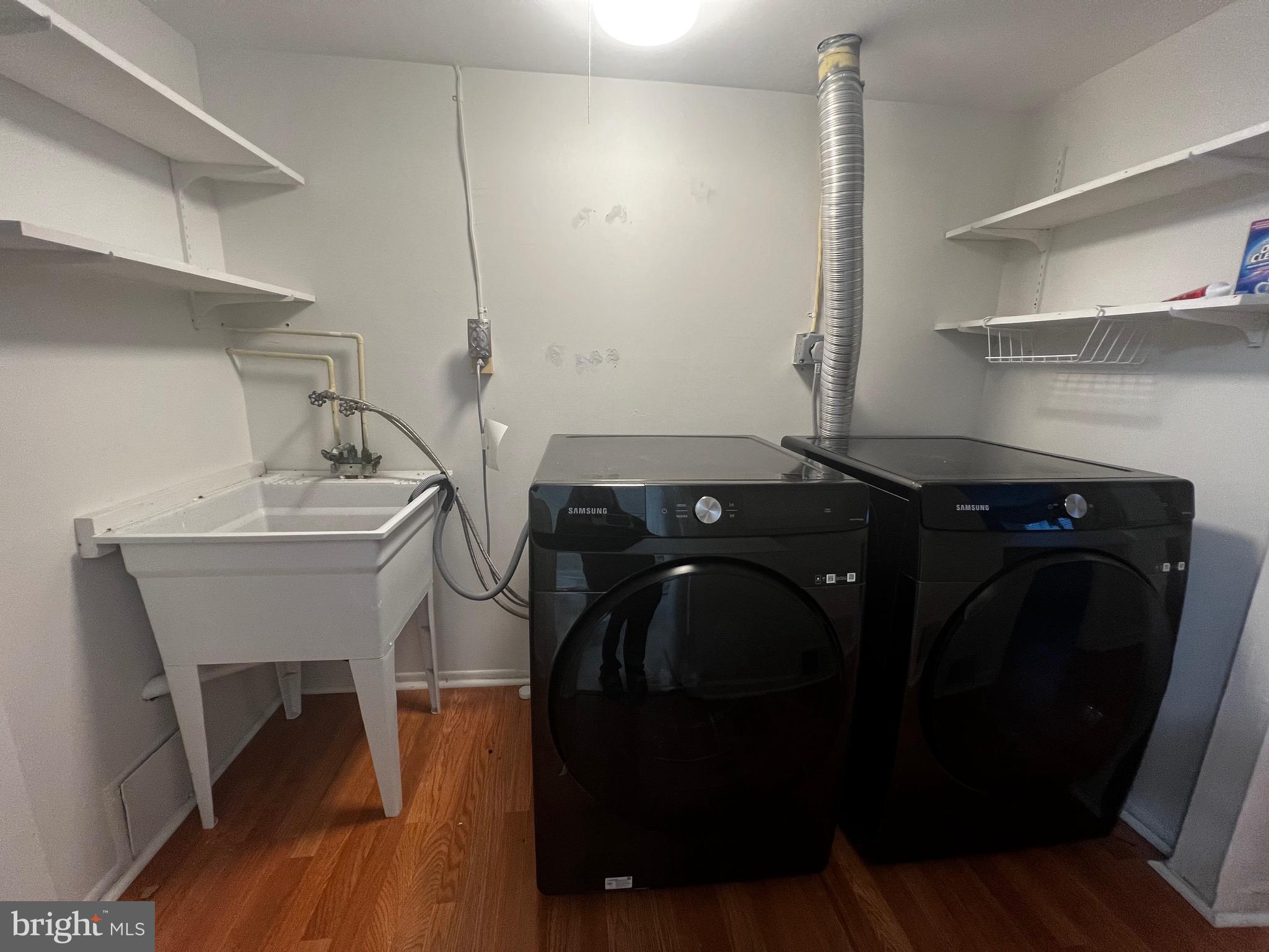 7148 Lasting Light Way Columbia, MD 21045 - Photo 17 of 20 a utility room with dryer and washer