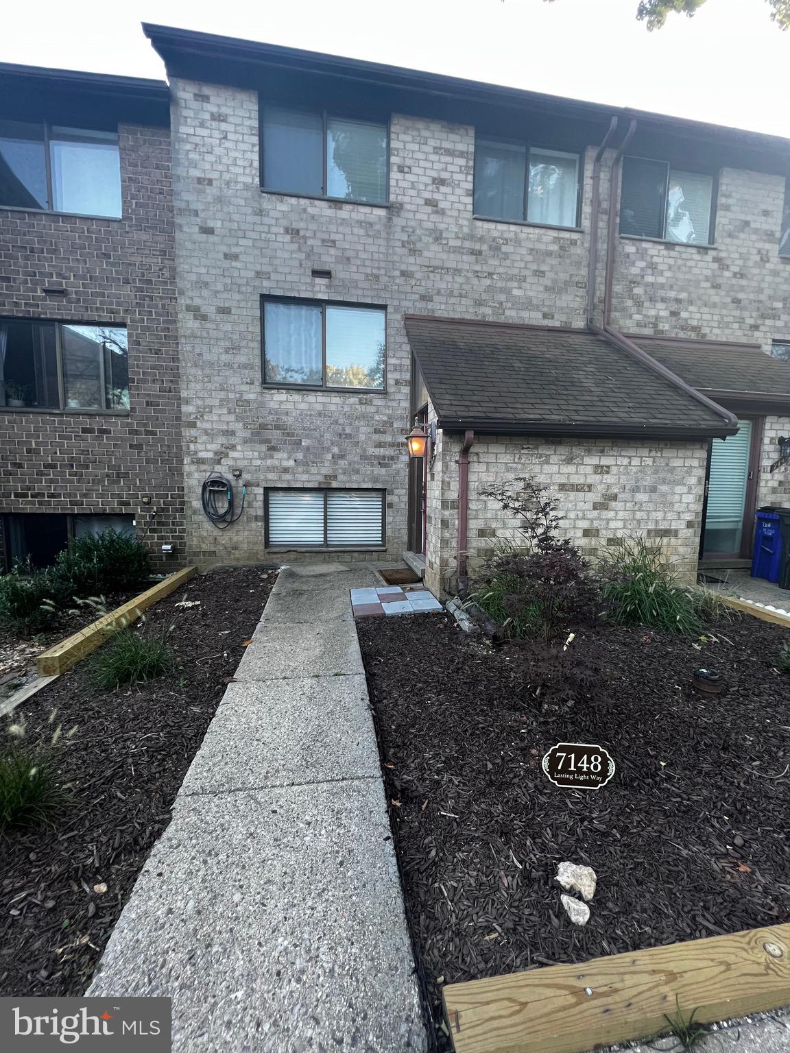 7148 Lasting Light Way Columbia, MD 21045 - Photo 2 of 20 a front view of a house with garden