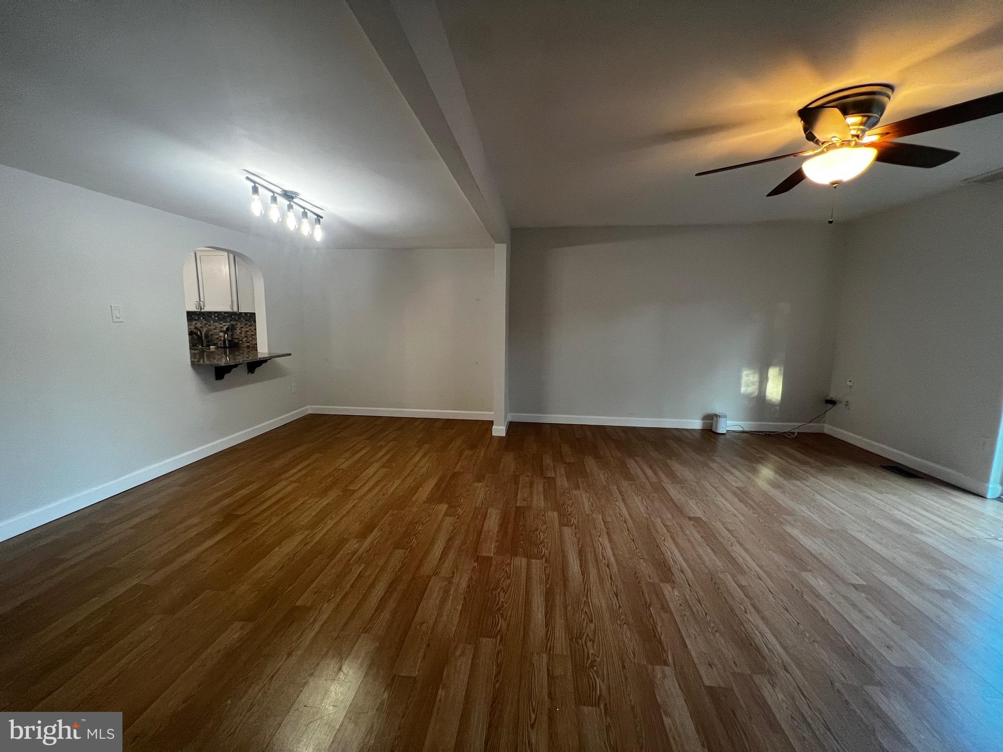 7148 Lasting Light Way Columbia, MD 21045 - Photo 5 of 20 a view of empty room with wooden floor