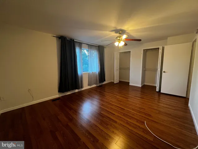a view of a livingroom with wooden floor