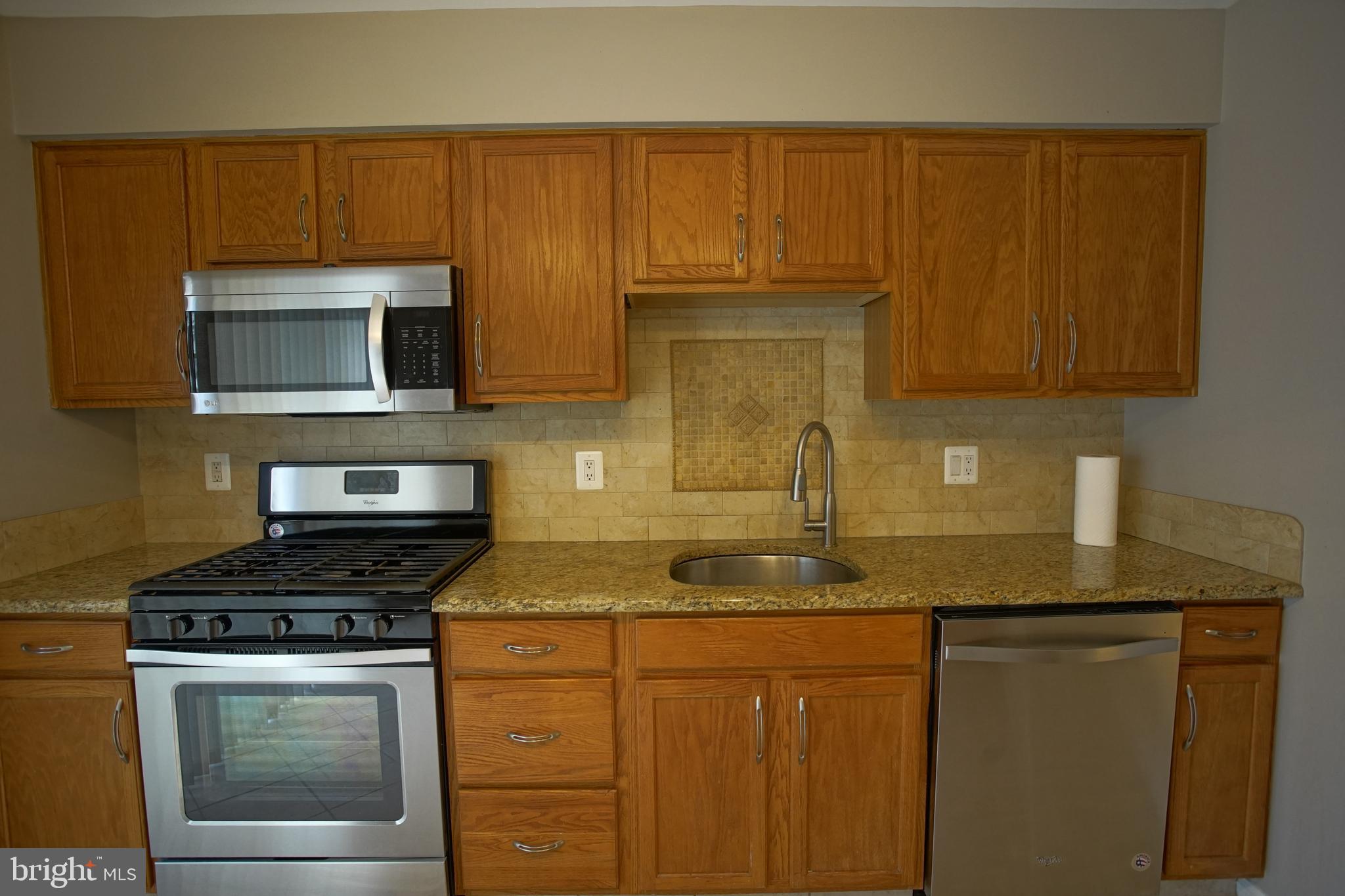 5808 Coventry Way Mount Laurel, NJ 08054 - Photo 11 of 41 a kitchen with granite countertop cabinets stainless steel appliances and a counter space